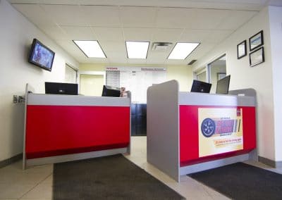 A red and white reception area in a business.