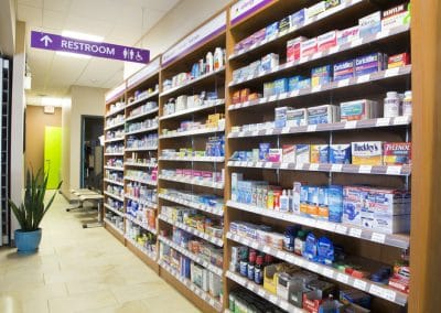 A pharmacy with shelves full of medicine.